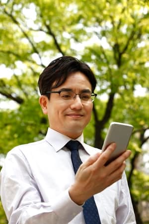 a portrait of an Asian man in a suit