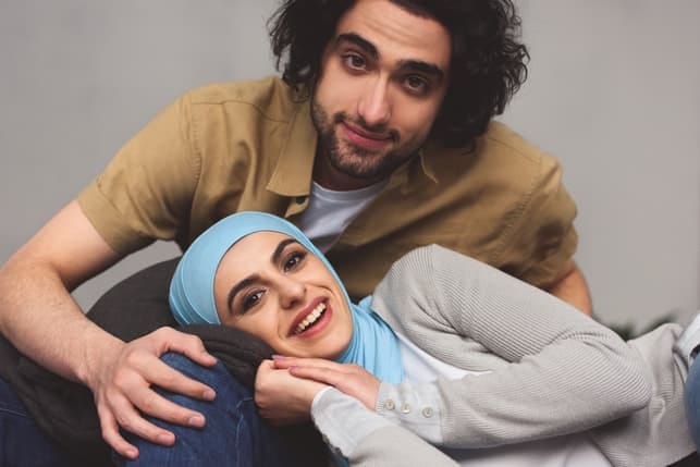 a young Muslim couple posing together