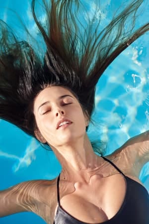 a dark-haired woman in bikini swimming in a pool
