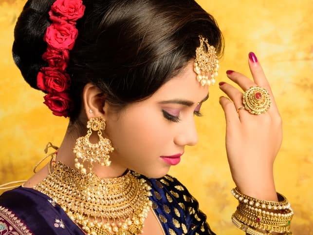 an attractive young indian woman dressed in traditional clothing
