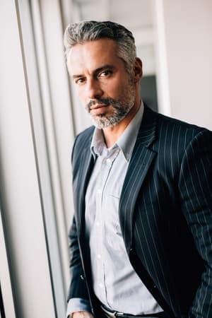 a handsome mature man is a suit