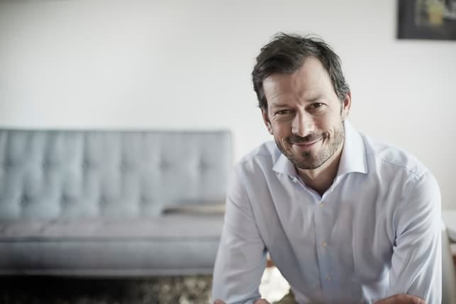 a smiling man in the office