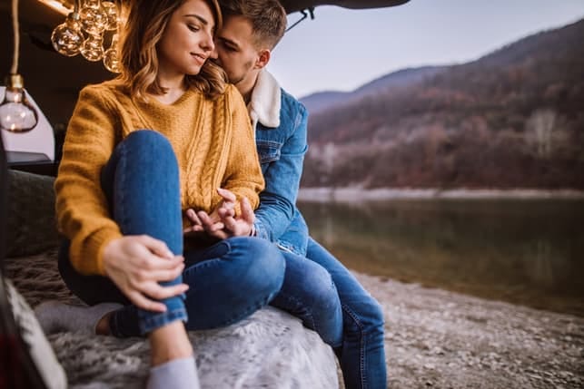 a couple having a walk in fall