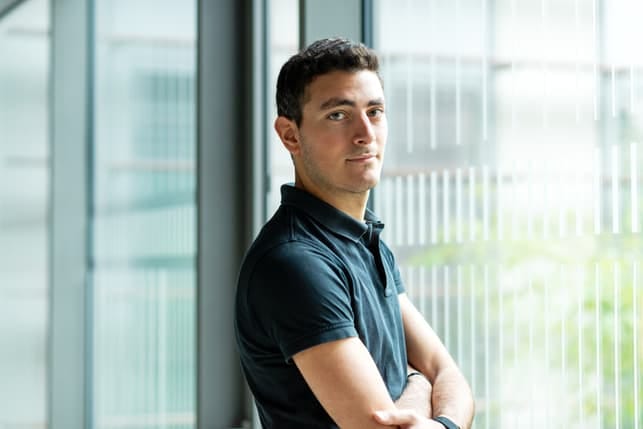 a portrait of an attractive middle-aged man posing indoors