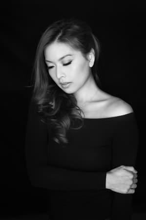 a black-and-white portrait of an Asian woman