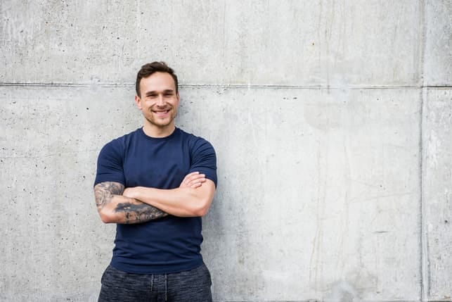 a portrait of a man with a tattoo