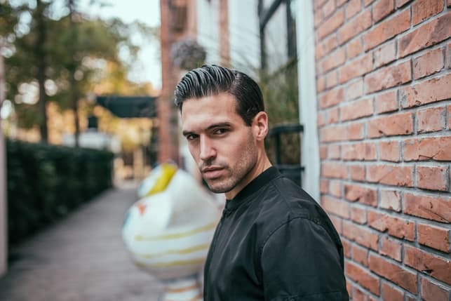 a portrait of a handsome short man