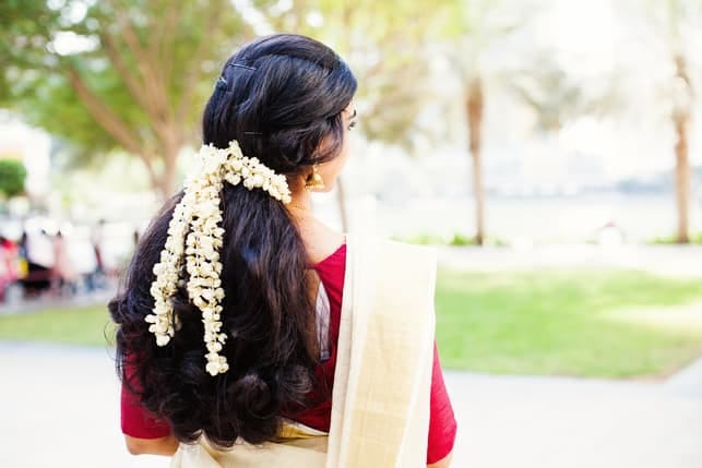 a back view of a traditionally-dressed indian woman