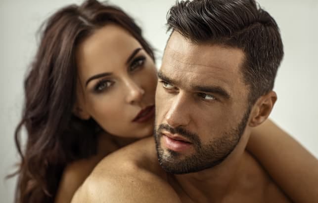 a beautiful serious couple posing together