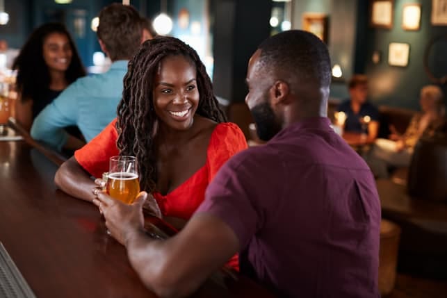 a black couple on a date at a restaurant