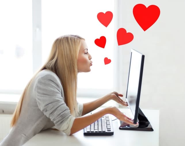 a woman is chatting with someone she loves via her laptop