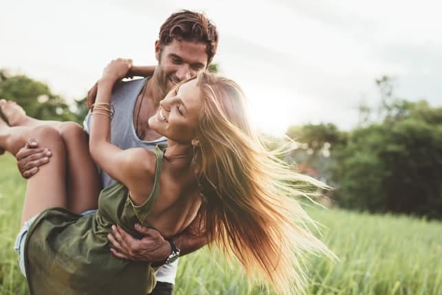 a couple having a date in the summer field