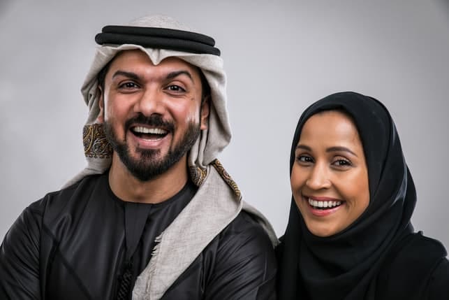 a happy Muslim couple posing together