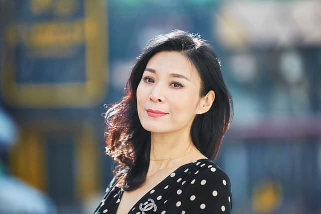 a portrait of a middle-aged Asian woman