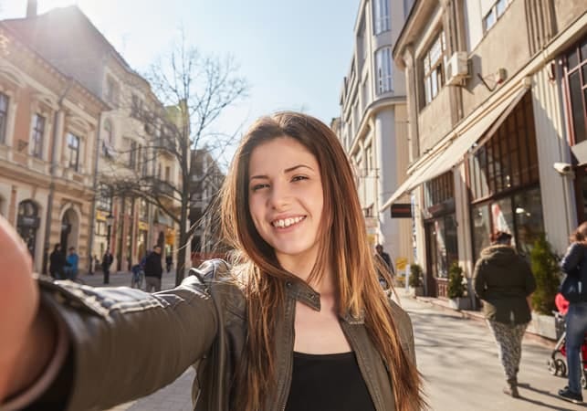 a young girl taking a selfie